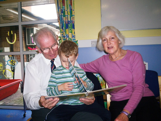 Grandparents playing with their grandson on grandparents day