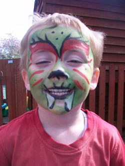 A little boy with his face painted as a dragon to celebrate St.Georges Day 2009