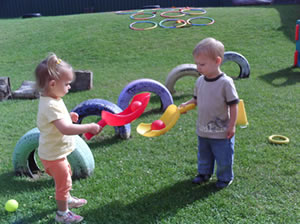 Children playing in the garden of their nursery as part of the Change4Life initiative for a more active lifestyle