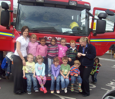 Staff and children celebrating National Fire Fighters Day at our childrens nursery in Rugby