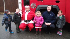 Local Firefighters from Sale Fire Station escorted Santa to the nursery on their fire engine, adding a Santa hat to their customary uniforms.