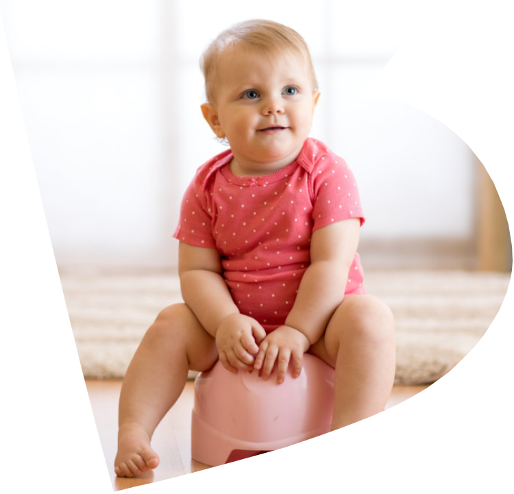 Little girl learning to sit on a potty